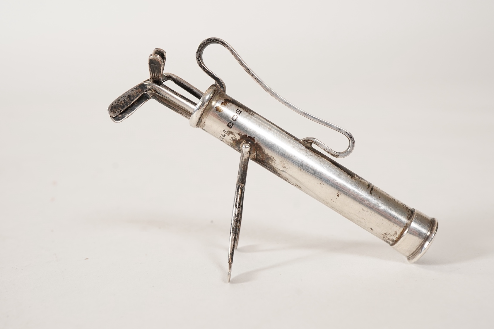A set of six George V novelty silver cocktail sticks with holder, modelled as a golf bag with clubs, by John Nowill & Sons